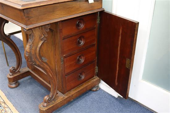 A late Victorian walnut davenport W.56cm